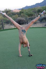 Naked Redhead Teen Doing Cartwheels On The Green